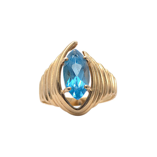 14ct yellow gold Ring of modernistic design and set with a Blue Topaz