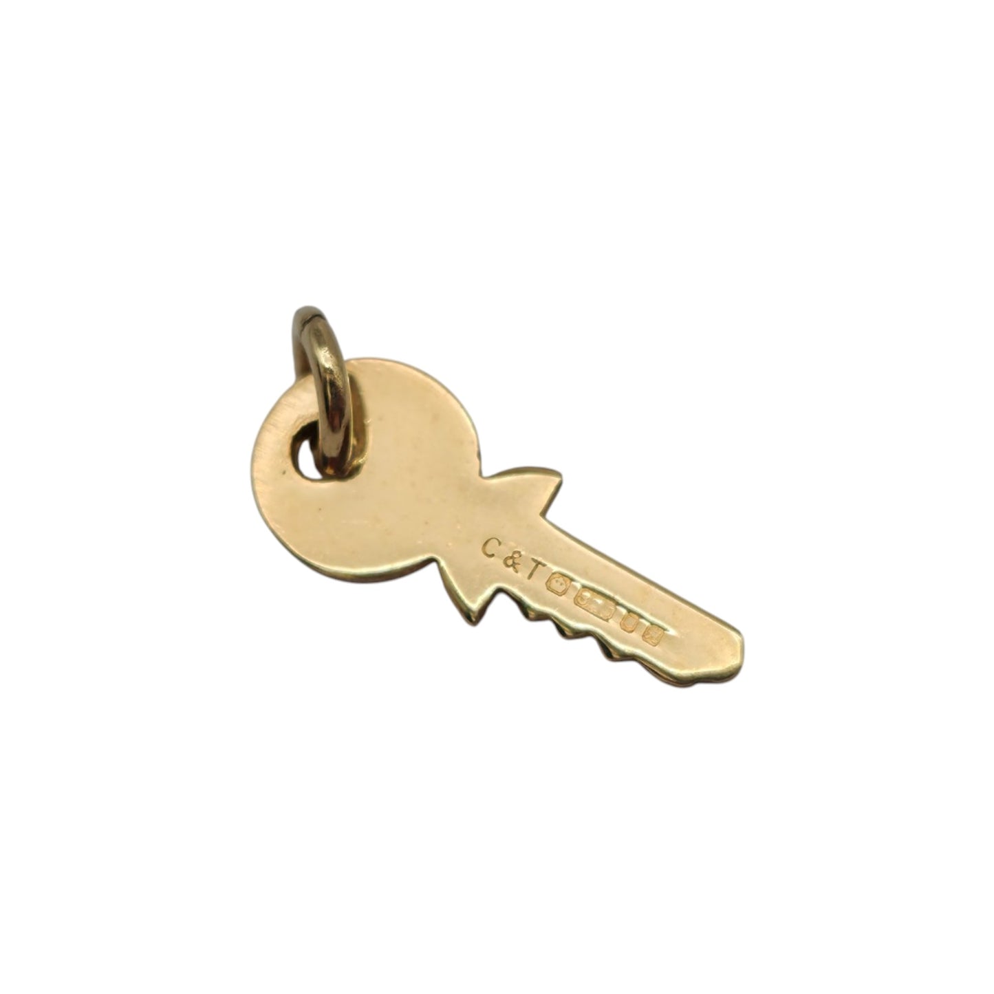 9ct 375 Yellow Gold Key Charm 1982 L 1.5 cm 0.7 g.