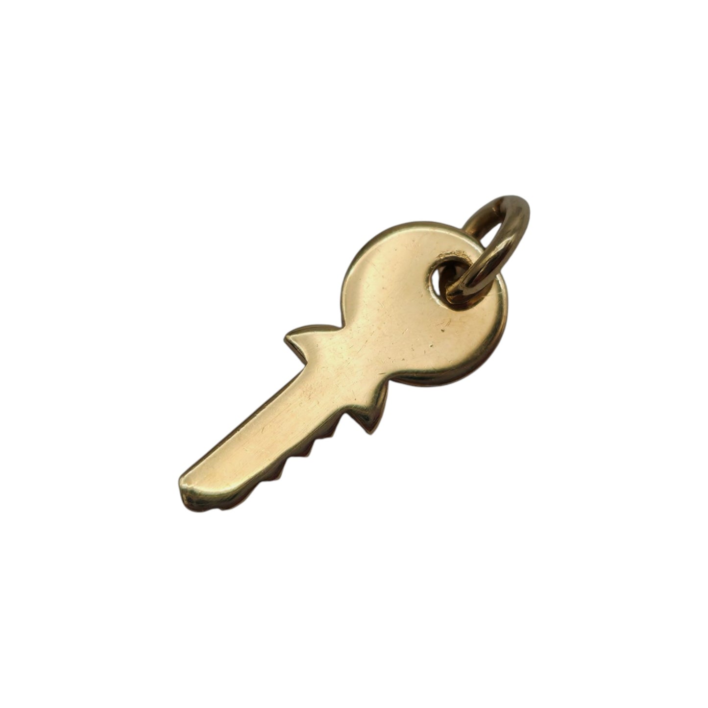 9ct 375 Yellow Gold Key Charm 1982 L 1.5 cm 0.7 g.