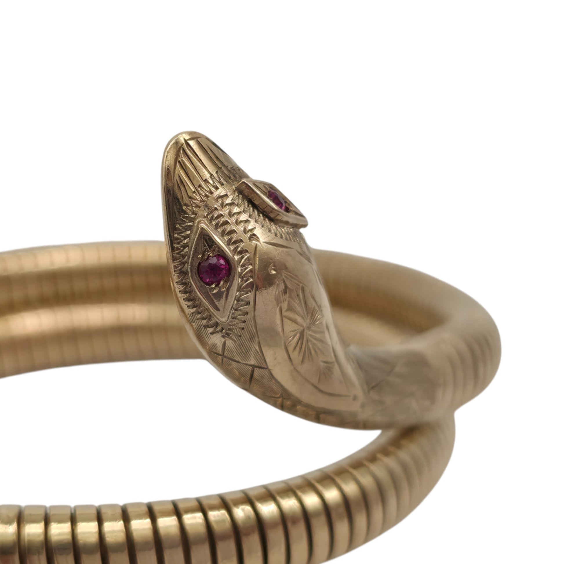pre-owned 9ct gold Flexible Coiled Snake Bangle set with two Ruby eyes.