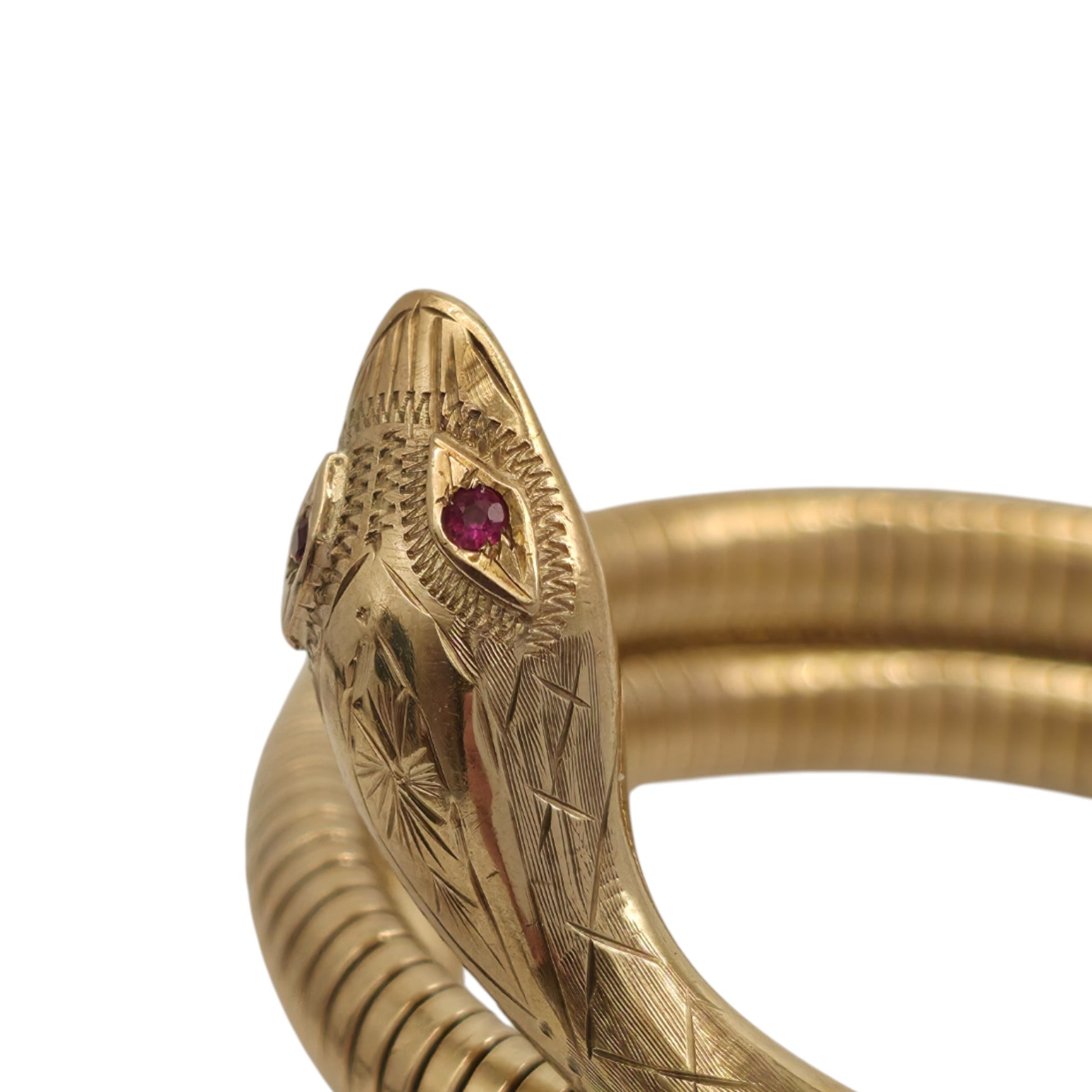 pre-owned 9ct gold Flexible Coiled Snake Bangle set with two Ruby eyes.
